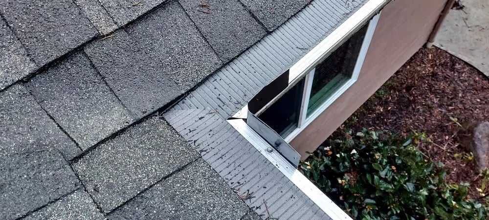 Close-up of a high-quality micro-mesh gutter guard installed on a residential gutter system to prevent clogs and reduce maintenance.